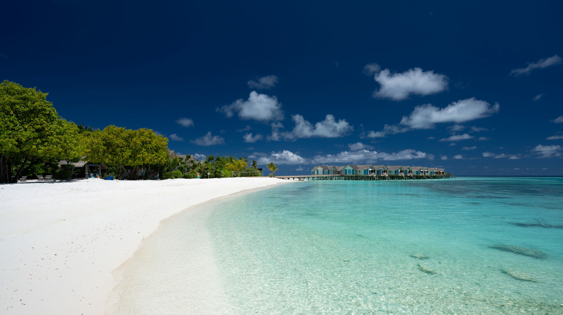 Picturesque View of Floating Cottages and Island from the Land, a Tranquil Coastal Retreat