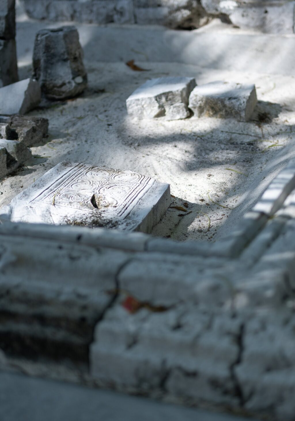 Historical Clay Tablets on Sandy Ground: Outdoor Heritage Site with Ancient Artifacts