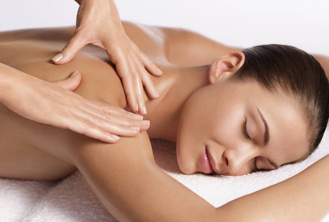 Relaxed Woman Enjoying Back Massage, Indulging in a Moment of Bliss and Relaxation